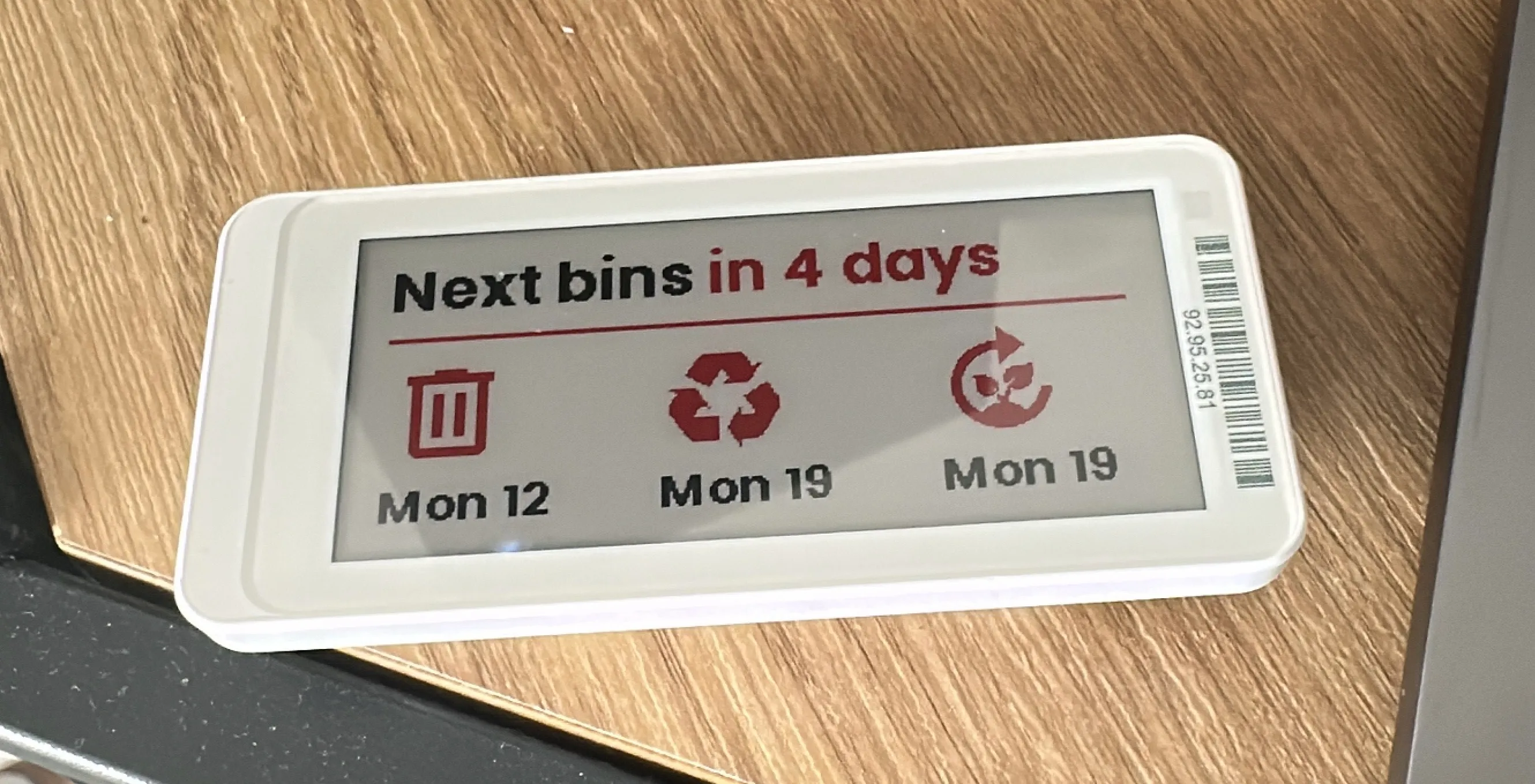 An Electronic Shelf Label displaying collection details for garden, refuse and recycling