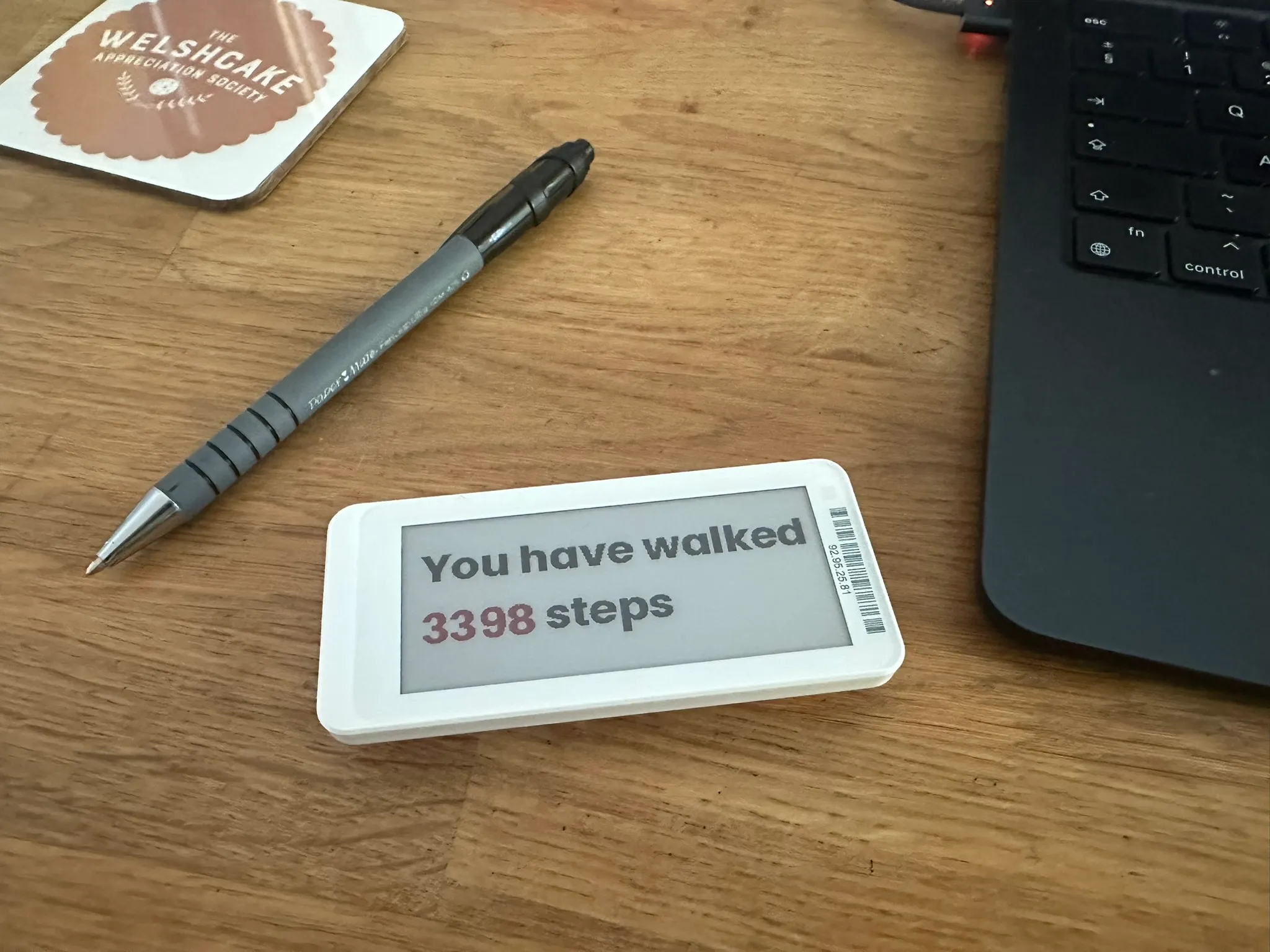 An Electronic Shelf Label displaying the message 'You have walked 3398 steps'